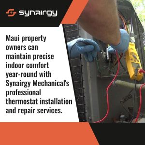 HVAC technician using a digital multimeter to inspect wiring inside an outdoor air conditioning unit during professional thermostat installation and repair service.