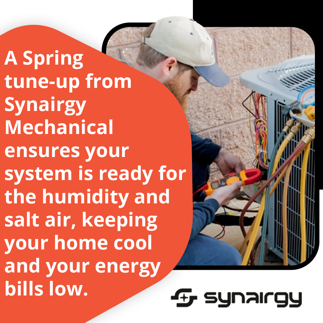 HVAC technician performing spring AC tune-up and system inspection for optimal cooling performance